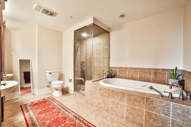 132 Lakefront Blvd Unit 204, Buffalo, NY 14202 - full bath featuring a garden tub, toilet, a shower stall, and tile patterned flooring