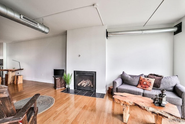 132 Lakefront Blvd Unit 204, Buffalo, NY 14202 - living area with wood finished floors and a fireplace