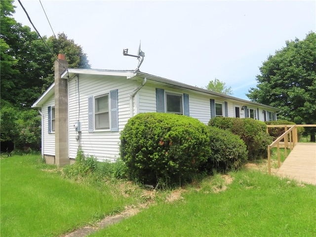 5015 S Centenary Rd, Sodus, NY 14505 - view of side of home with a chimney and a wooden deck