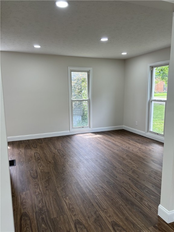 3758 Lake Rd N, Clarkson, NY 14420 - unfurnished room with baseboards, dark wood-type flooring, healthy amount of natural light, and recessed lighting