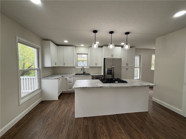 3758 Lake Rd N, Clarkson, NY 14420 - kitchen with appliances with stainless steel finishes, a sink, baseboards, dark wood-style flooring, and a textured ceiling