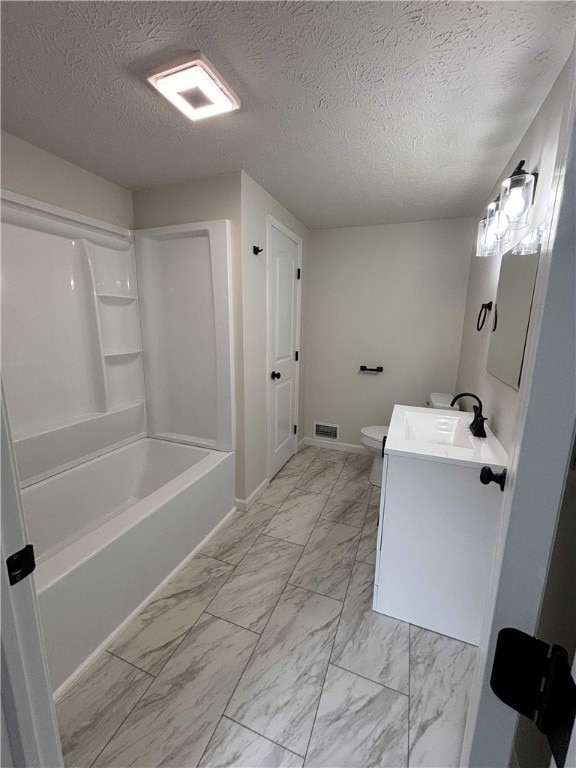 3758 Lake Rd N, Clarkson, NY 14420 - bathroom with marble look tiles, vanity, toilet, a textured ceiling, and bathtub / shower combination