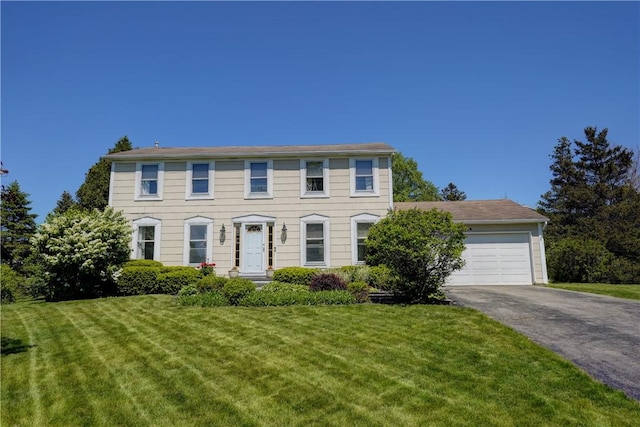 16 Canterbury Trl, Penfield, NY 14450 - colonial inspired home with driveway, an attached garage, and a front lawn