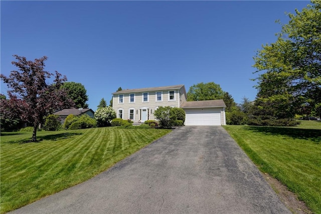 16 Canterbury Trl, Penfield, NY 14450 - colonial house featuring a front yard and a garage