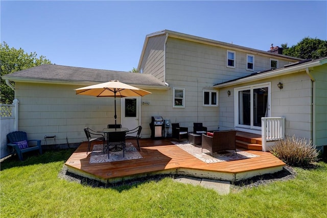 16 Canterbury Trl, Penfield, NY 14450 - back of house with a yard, a deck, roof with shingles, and outdoor dining area