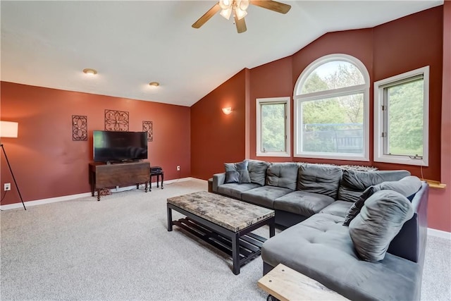 16 Canterbury Trl, Penfield, NY 14450 - carpeted living room with ceiling fan, vaulted ceiling, and baseboards