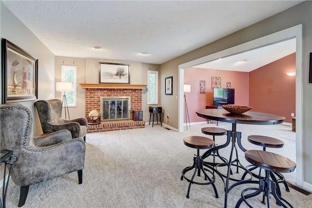 16 Canterbury Trl, Penfield, NY 14450 - living room featuring carpet flooring, baseboards, and a brick fireplace