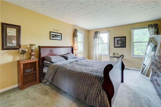 16 Canterbury Trl, Penfield, NY 14450 - bedroom featuring carpet flooring, baseboards, a textured ceiling, and multiple windows