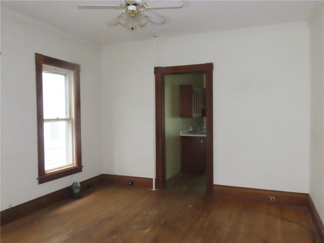 11 Cortland St, Geneva-City, NY 14456 - spare room featuring baseboards, plenty of natural light, and wood finished floors