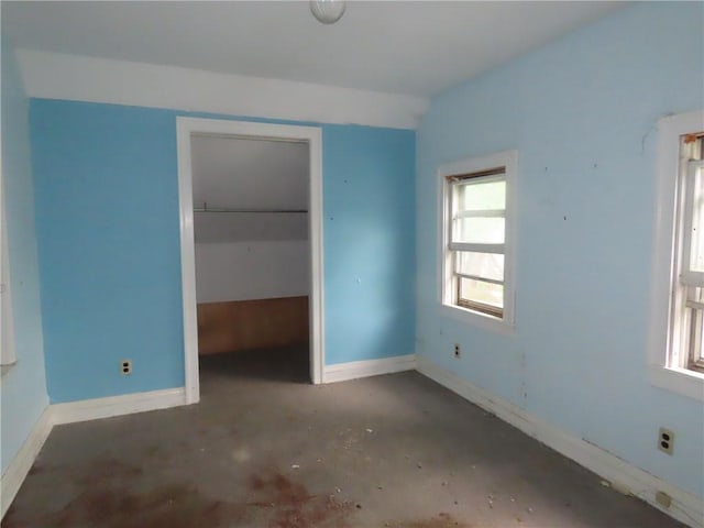 11 Cortland St, Geneva-City, NY 14456 - unfurnished bedroom with multiple windows, baseboards, and a closet