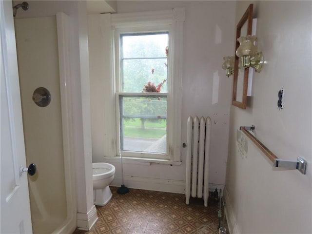 11 Cortland St, Geneva-City, NY 14456 - bathroom with radiator heating unit, a shower, toilet, and baseboards