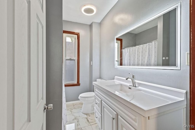 410 John St, Syracuse, NY 13208 - full bath featuring marble look tiles, toilet, vanity, and baseboards