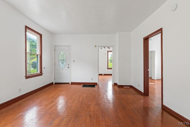 410 John St, Syracuse, NY 13208 - foyer featuring plenty of natural light, wood finished floors, and baseboards