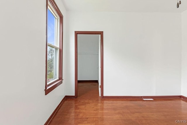 410 John St, Syracuse, NY 13208 - spare room featuring wood finished floors and baseboards