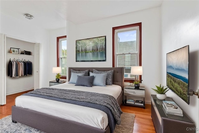 410 John St, Syracuse, NY 13208 - bedroom with light wood-type flooring and a closet