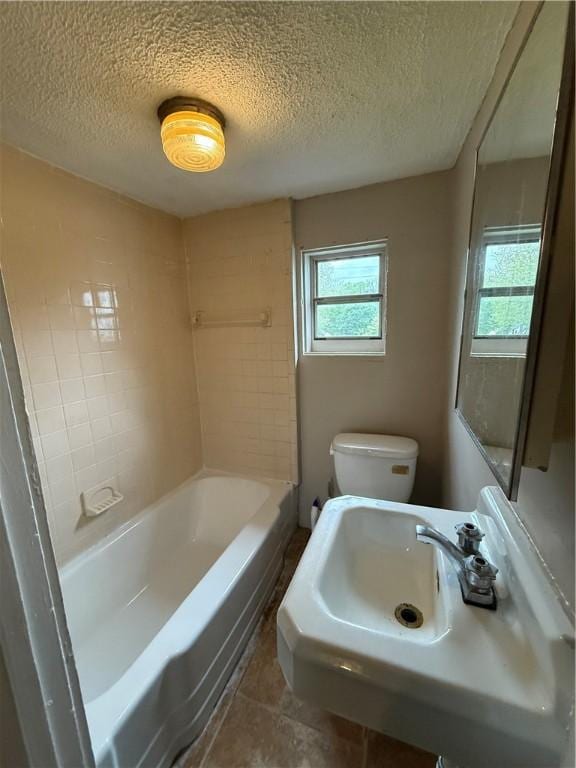 180 Norran Dr, Rochester, NY 14609 - full bath with a textured ceiling, toilet, and a sink