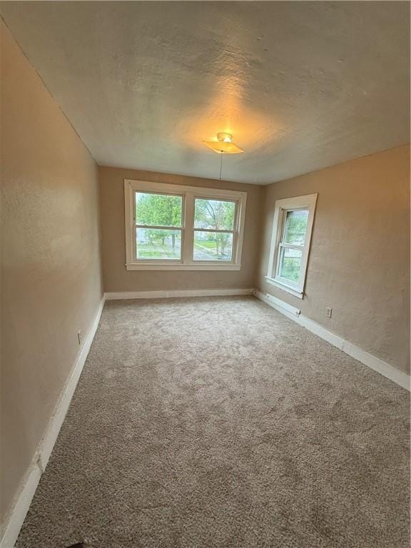 180 Norran Dr, Rochester, NY 14609 - unfurnished room with baseboards and carpet floors