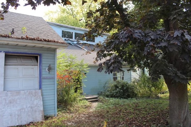 1838 Davis Rd, Aurora, NY 14170 - view of side of property featuring roof with shingles