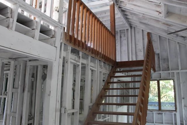 1838 Davis Rd, Aurora, NY 14170 - stairs featuring lofted ceiling