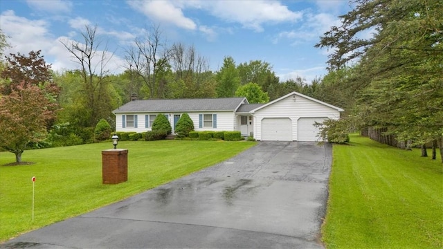 3343 Cory Hill Rd, Marion, NY 14505 - single story home featuring a garage, asphalt driveway, and a front yard