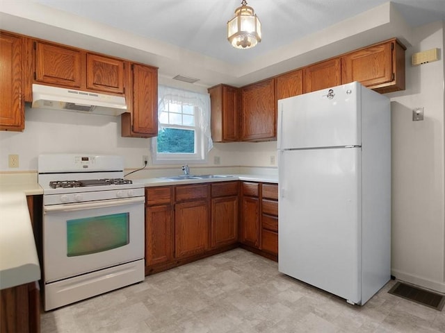 3343 Cory Hill Rd, Marion, NY 14505 - kitchen featuring white appliances, under cabinet range hood, brown cabinetry, and a sink