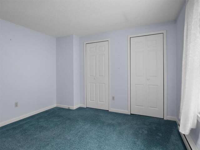 3343 Cory Hill Rd, Marion, NY 14505 - unfurnished bedroom with carpet flooring, baseboards, and a baseboard heating unit