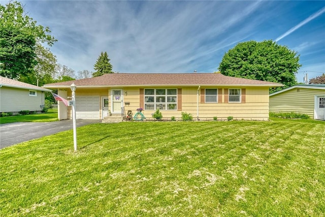 39 Ingram Dr, Gates, NY 14624 - single story home featuring driveway, an attached garage, and a front lawn