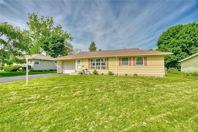 39 Ingram Dr, Gates, NY 14624 - single story home with a garage, asphalt driveway, and a front lawn
