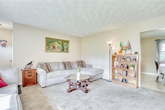 39 Ingram Dr, Gates, NY 14624 - carpeted living room featuring baseboards and a textured ceiling