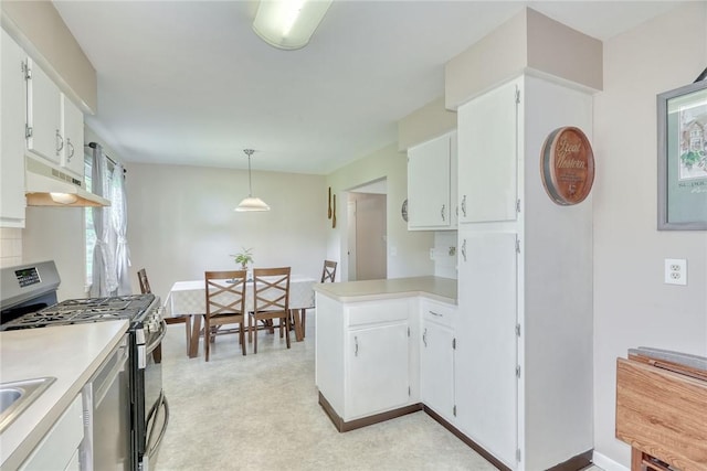 39 Ingram Dr, Gates, NY 14624 - kitchen featuring stainless steel range with gas stovetop, under cabinet range hood, a peninsula, light countertops, and white cabinets