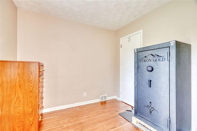 39 Ingram Dr, Gates, NY 14624 - detailed view of wood finished floors, baseboards, and a textured ceiling
