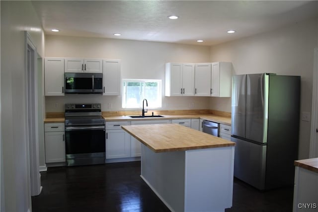 8766 N Main St, Le Ray, NY 13637 - kitchen with stainless steel appliances, a sink, butcher block counters, white cabinets, and recessed lighting