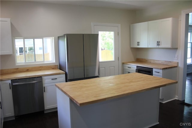 8766 N Main St, Le Ray, NY 13637 - kitchen with wooden counters, stainless steel appliances, white cabinets, a center island, and dark wood-style floors
