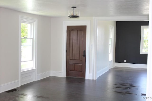 8766 N Main St, Le Ray, NY 13637 - entryway featuring dark wood finished floors, plenty of natural light, and baseboards