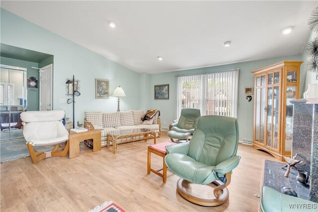 950 Hopkins Rd Unit B, Amherst, NY 14221 - living area featuring vaulted ceiling and wood finished floors