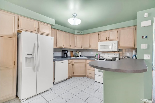 950 Hopkins Rd Unit B, Amherst, NY 14221 - kitchen featuring white appliances, light brown cabinets, a peninsula, and decorative backsplash