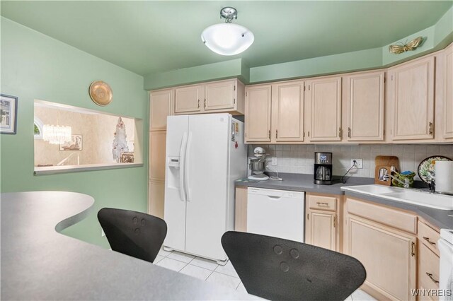 950 Hopkins Rd Unit B, Amherst, NY 14221 - kitchen with white appliances, a sink, decorative backsplash, light tile patterned floors, and a chandelier