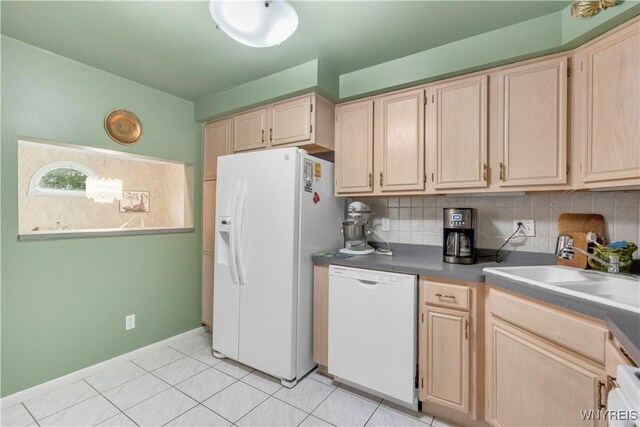 950 Hopkins Rd Unit B, Amherst, NY 14221 - kitchen featuring white appliances, a sink, light brown cabinetry, decorative backsplash, and baseboards