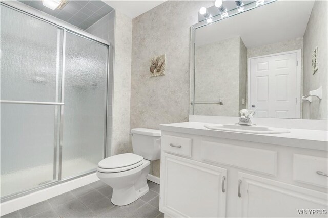 950 Hopkins Rd Unit B, Amherst, NY 14221 - bathroom with toilet, vanity, a shower stall, and tile patterned flooring