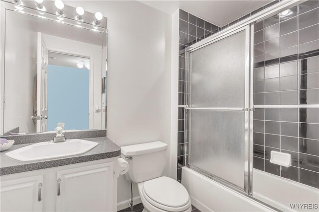 950 Hopkins Rd Unit B, Amherst, NY 14221 - bathroom with vanity, toilet, and bath / shower combo with glass door