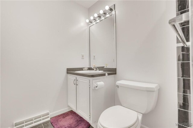 950 Hopkins Rd Unit B, Amherst, NY 14221 - bathroom featuring toilet, vanity, and baseboards