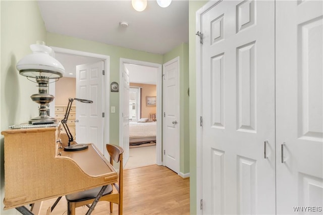 950 Hopkins Rd Unit B, Amherst, NY 14221 - corridor with light wood finished floors and baseboards