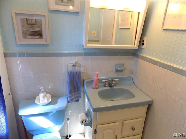 806 Mildred Ave, Utica, NY 13502 - bathroom featuring vanity, tile walls, toilet, and backsplash