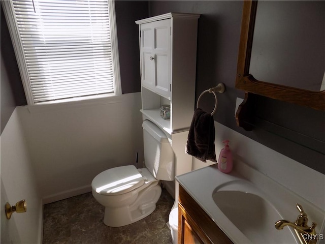 806 Mildred Ave, Utica, NY 13502 - bathroom featuring toilet, vanity, and baseboards