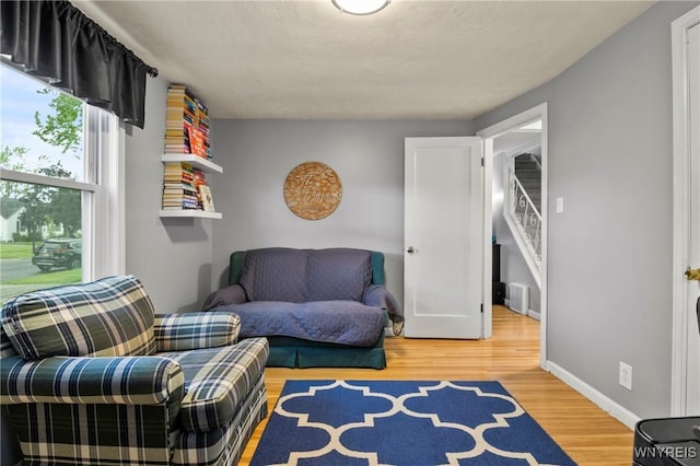 1587 Parker Blvd, Tonawanda-Town, NY 14150 - living area featuring wood finished floors, stairs, and baseboards