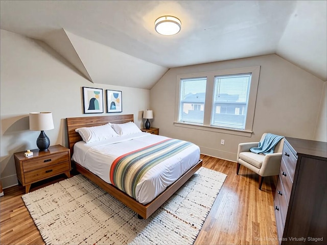 257 Haviland Park, Greece, NY 14616 - bedroom with vaulted ceiling, light wood finished floors, and baseboards