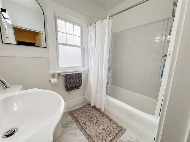 257 Haviland Park, Greece, NY 14616 - bathroom with marble finish flooring, a sink, shower / bath combination with curtain, and baseboards