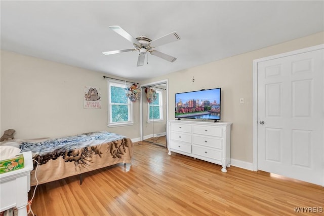8918 Hurlburt Ln, Clarence, NY 14031 - bedroom with light wood finished floors, baseboards, and ceiling fan