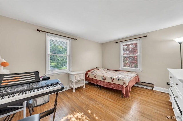 8918 Hurlburt Ln, Clarence, NY 14031 - bedroom with light wood-style floors and baseboards