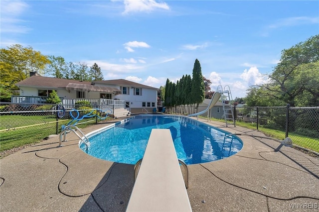 8918 Hurlburt Ln, Clarence, NY 14031 - view of swimming pool with a water slide, a diving board, and a patio